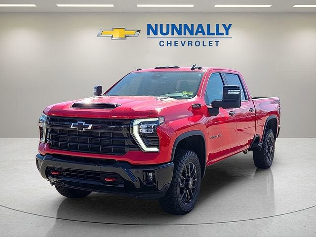 2026 Chevrolet Silverado 2500 HD LT in Red Hot — front three-quarter view